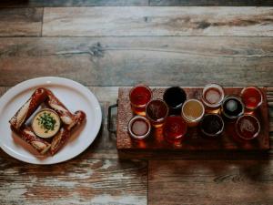 Pretzel rods with cheese sauce and a beer flight